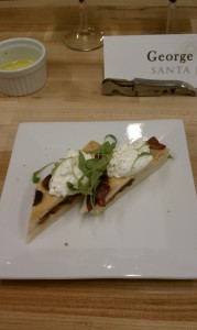 Goat Cheese Ricotta over Shiacciata l'uva bread with raisins and grapes